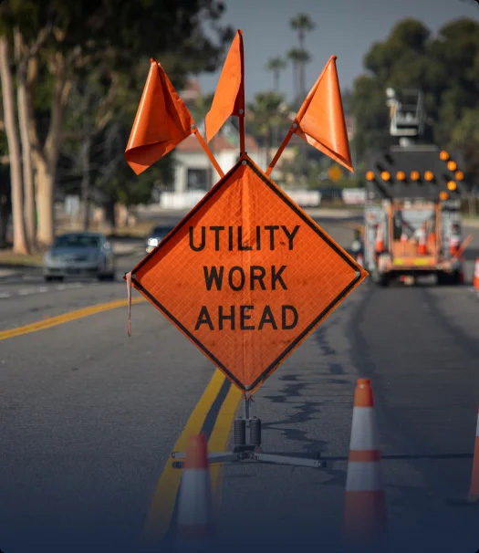utility work ahead sign on street